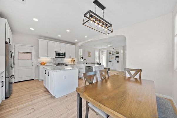 Dining room, Interior, Kitchen, Pendant Lights, Recessed Lighting, Stainless Steel Appliances, Wood Texture Flooring