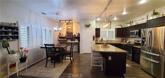 Dining room, Interior, Kitchen, Pendant Lights, Recessed Lighting, Stainless Steel Appliances, Wood Texture Flooring