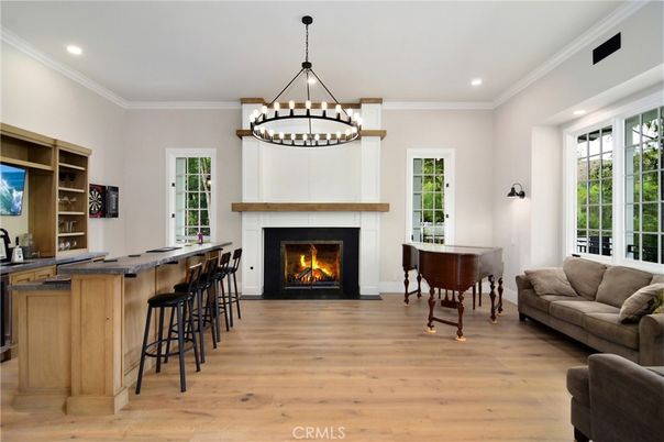Chandelier, Fireplace, Interior, Pendant Lights, Piano, Recessed Lighting, Wood Texture Flooring
