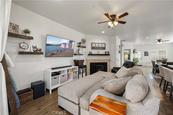Dining room, Fireplace, Interior, Living room, Recessed Lighting, Wood Texture Flooring