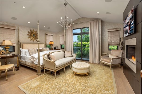 Bedroom, Chandelier, Fireplace, Interior, Recessed Lighting, Wood Texture Flooring