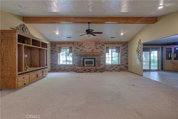 Empty room, Fireplace, Interior, Recessed Lighting, Stone Walls, Wooden Beams