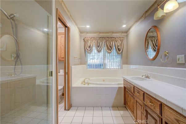 Bathroom, Dual Sink Vanities, Glass Shower, Interior, Recessed Lighting, Tile Countertops