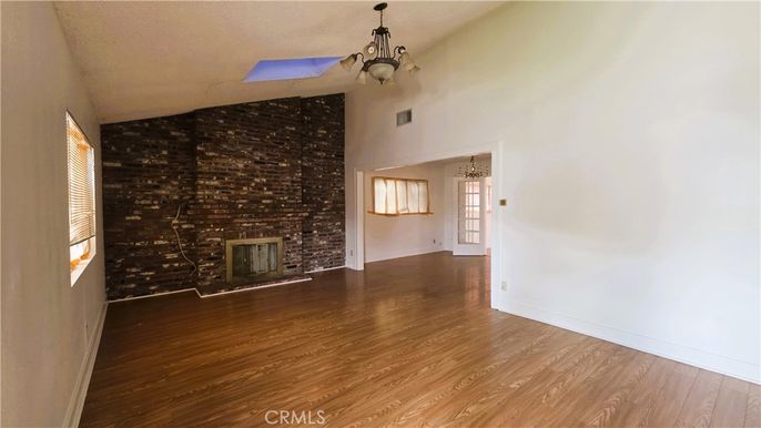 Chandelier, Empty room, Fireplace, Interior, Pendant Lights, Stone Walls, Wood Texture Flooring