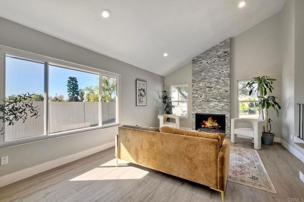 Fireplace, Interior, Living room, Recessed Lighting, Stone Walls, Wood Texture Flooring