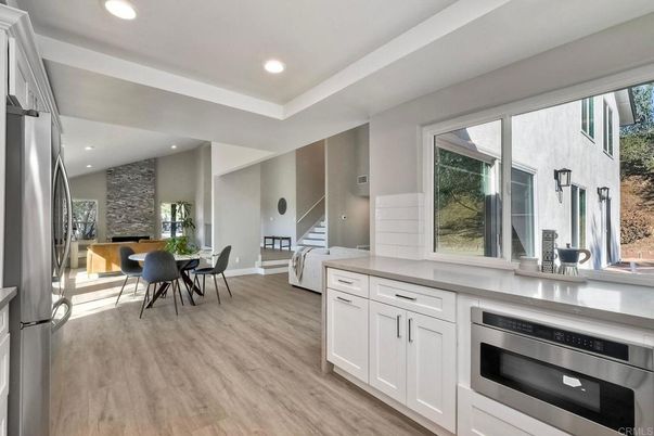 Dining room, Interior, Kitchen, Recessed Lighting, Stainless Steel Appliances, Wood Texture Flooring