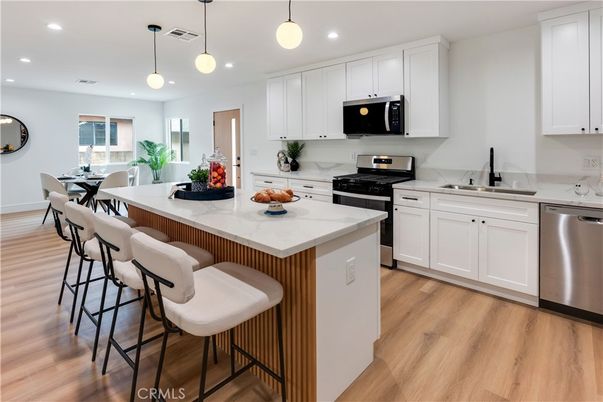 Dining room, Interior, Kitchen, Pendant Lights, Recessed Lighting, Stainless Steel Appliances, Wood Texture Flooring
