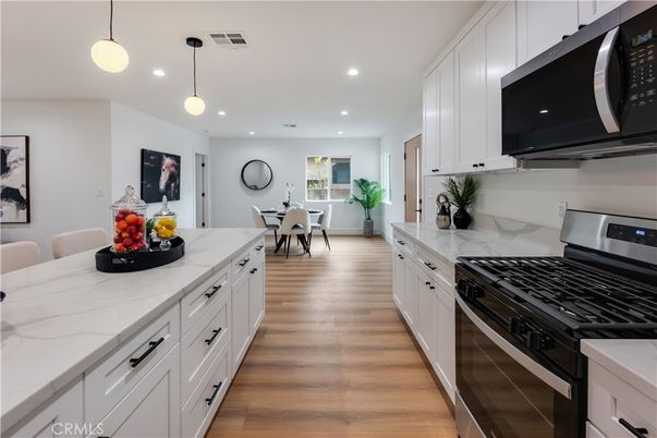 Dining room, Interior, Kitchen, Pendant Lights, Recessed Lighting, Stainless Steel Appliances, Wood Texture Flooring