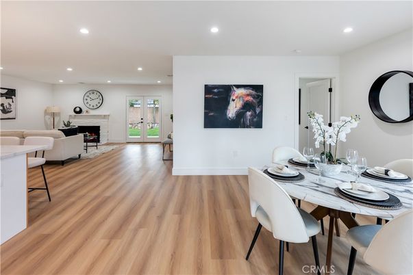 Dining room, Fireplace, Interior, Living room, Recessed Lighting, Wood Texture Flooring