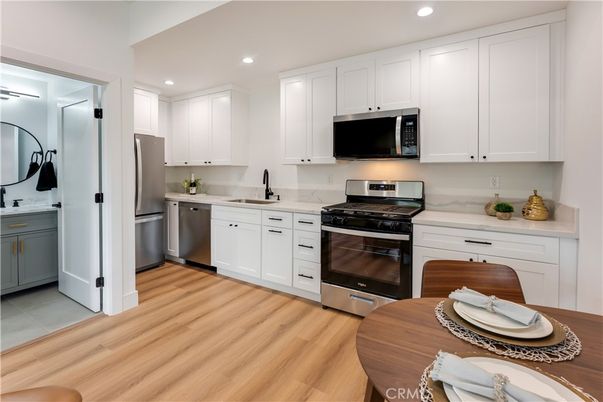 Interior, Kitchen, Recessed Lighting, Stainless Steel Appliances, Wood Texture Flooring