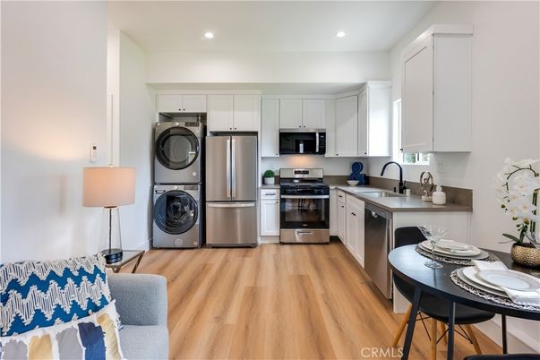 Interior, Kitchen, Recessed Lighting, Stainless Steel Appliances, Washer, Wood Texture Flooring