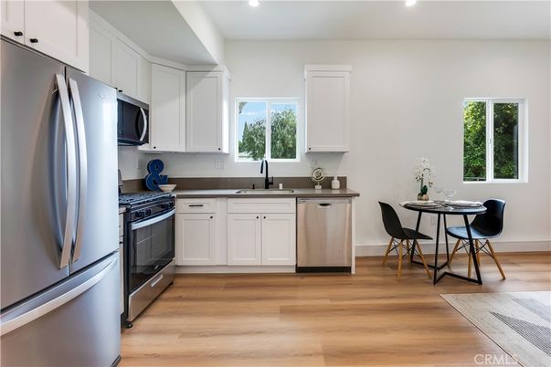 Dining room, Interior, Kitchen, Recessed Lighting, Stainless Steel Appliances, Wood Texture Flooring