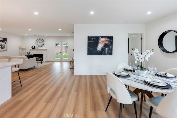Dining room, Fireplace, Interior, Living room, Recessed Lighting, Wood Texture Flooring