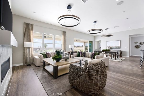 Dining room, Fireplace, Interior, Living room, Pendant Lights, Recessed Lighting, Wood Texture Flooring