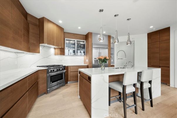 Interior, Kitchen, Marble Walls, Pendant Lights, Recessed Lighting, Stainless Steel Appliances, Wood Texture Flooring