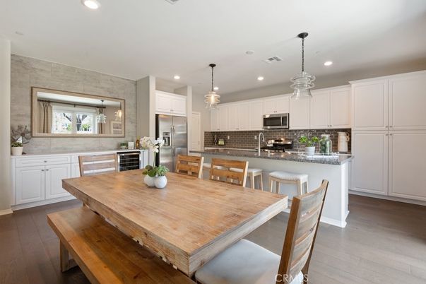 Dining room, Interior, Kitchen, Pendant Lights, Recessed Lighting, Stainless Steel Appliances, Wood Texture Flooring