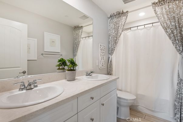 Bathroom, Dual Sink Vanities, Interior, Recessed Lighting, Wood Texture Flooring