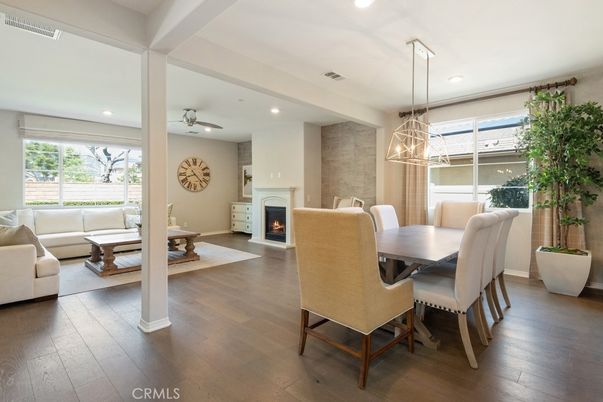Dining room, Fireplace, Interior, Living room, Pendant Lights, Recessed Lighting, Wood Texture Flooring