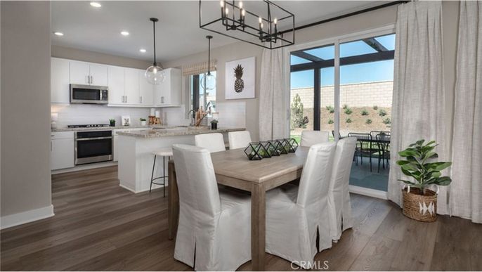 Chandelier, Dining room, Interior, Kitchen, Pendant Lights, Recessed Lighting, Stainless Steel Appliances, Wood Texture Flooring
