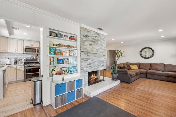 Fireplace, Interior, Kitchen, Living room, Recessed Lighting, Stainless Steel Appliances, Stone Walls, Wood Texture Flooring