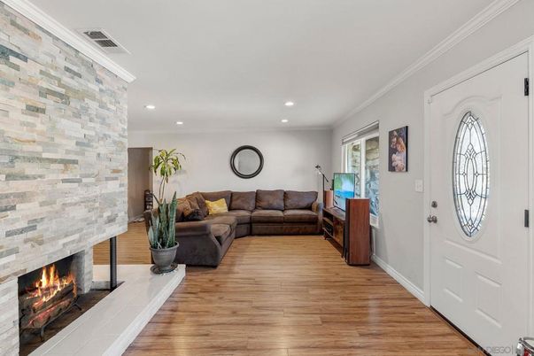 Fireplace, Interior, Living room, Recessed Lighting, Stone Walls, Wood Texture Flooring