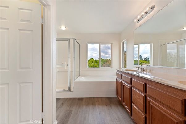 Bathroom, Dual Sink Vanities, Glass Shower, Interior, Wood Texture Flooring