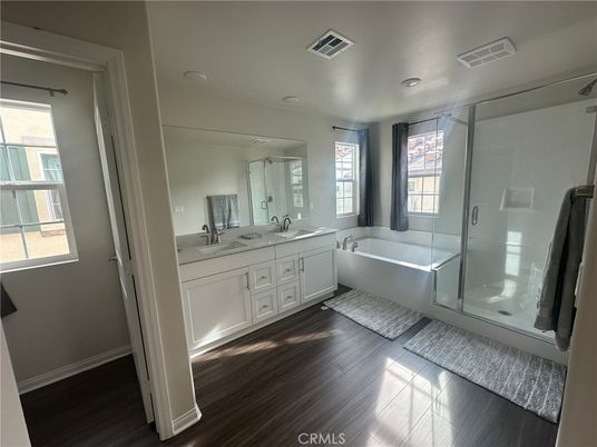 Bathroom, Dual Sink Vanities, Free Standing Baths, Glass Shower, Interior, Wood Texture Flooring