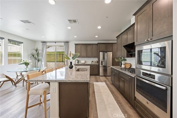 Dining room, Interior, Kitchen, Recessed Lighting, Stainless Steel Appliances, Wood Texture Flooring
