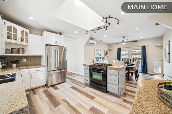 Dining room, Interior, Kitchen, Recessed Lighting, Stainless Steel Appliances, Wood Texture Flooring