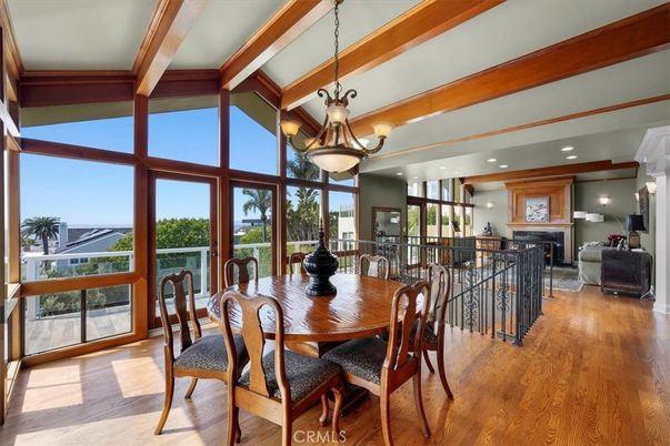 Chandelier, Dining room, Fireplace, Interior, Living room, Recessed Lighting, Wooden Beams, Wood Texture Flooring