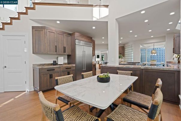 Dining room, Interior, Kitchen, Pendant Lights, Recessed Lighting, Stainless Steel Appliances, Wood Texture Flooring