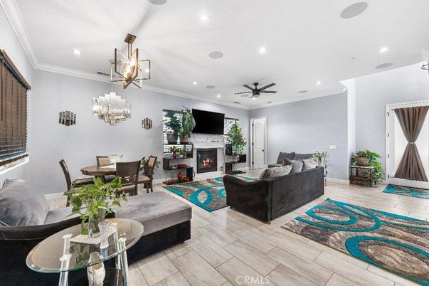Dining room, Fireplace, Interior, Living room, Pendant Lights, Recessed Lighting, Wood Texture Flooring