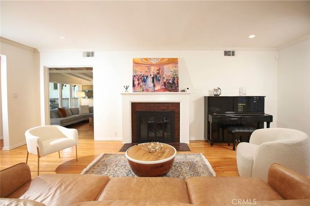 Fireplace, Interior, Living room, Piano, Recessed Lighting, Wood Texture Flooring