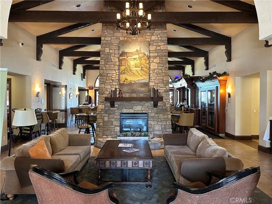 Chandelier, Dining room, Fireplace, Interior, Living room, Recessed Lighting, Stone Walls, Wooden Beams