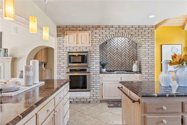 Fireplace, Interior, Kitchen, Pendant Lights, Recessed Lighting, Stainless Steel Appliances, Stone Walls
