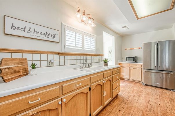 Interior, Kitchen, Stainless Steel Appliances, Tile Countertops, Wood Texture Flooring