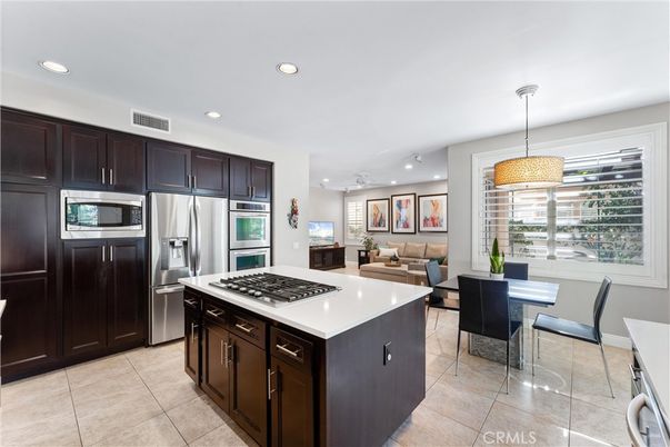 Chandelier, Dining room, Interior, Kitchen, Living room, Pendant Lights, Recessed Lighting, Stainless Steel Appliances