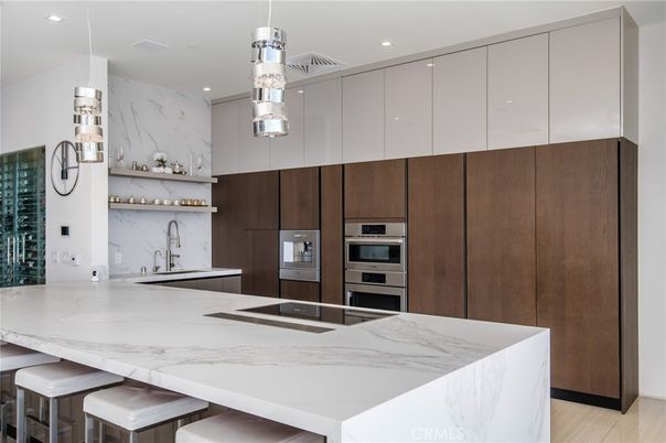 Interior, Kitchen, Marble Walls, Recessed Lighting, Stainless Steel Appliances, Wood Texture Flooring
