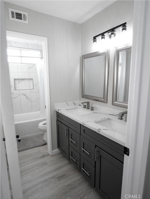 Bathroom, Dual Sink Vanities, Interior, Marble Walls, Wood Texture Flooring