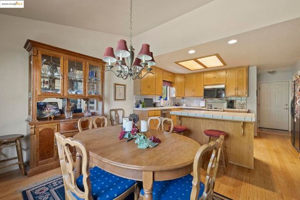 Chandelier, Dining room, Interior, Kitchen, Recessed Lighting, Tile Countertops, Wood Texture Flooring