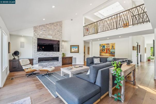 Fireplace, Interior, Living room, Recessed Lighting, Stone Walls, Wood Texture Flooring