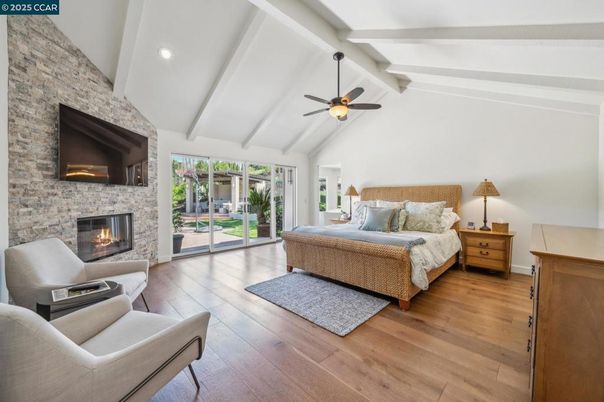 Bedroom, Fireplace, Interior, Recessed Lighting, Stone Walls, Wood Texture Flooring