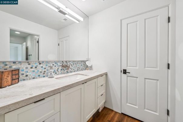 Bathroom, Dual Sink Vanities, Interior, Recessed Lighting, Wood Texture Flooring