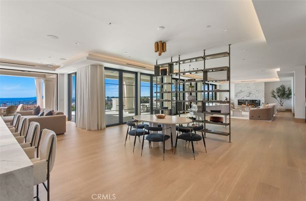 Dining room, Fireplace, Interior, Living room, Pendant Lights, Recessed Lighting, Water, Wood Texture Flooring