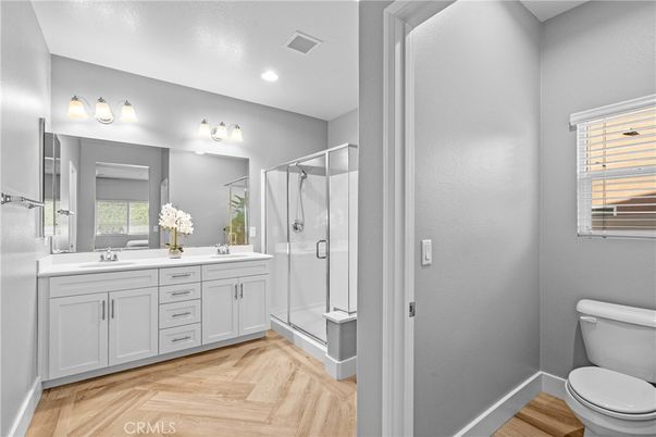 Bathroom, Dual Sink Vanities, Glass Shower, Interior, Recessed Lighting, Wood Texture Flooring