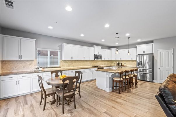 Dining room, Interior, Kitchen, Pendant Lights, Recessed Lighting, Stainless Steel Appliances, Wood Texture Flooring