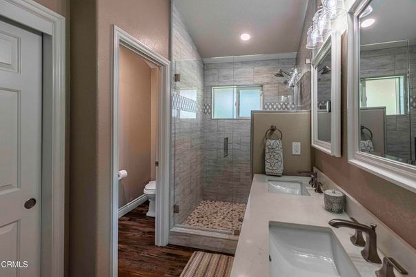 Bathroom, Dual Sink Vanities, Glass Shower, Interior, Recessed Lighting, Wood Texture Flooring