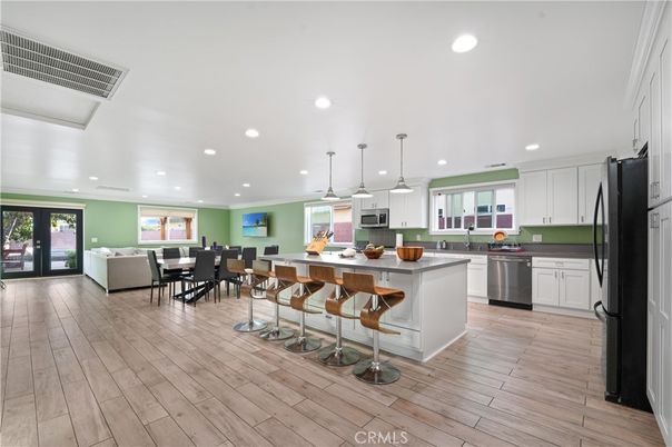 Dining room, Interior, Kitchen, Pendant Lights, Recessed Lighting, Stainless Steel Appliances, Wood Texture Flooring