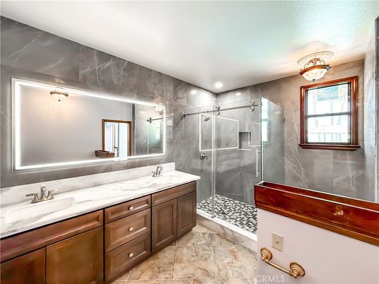 Bathroom, Dual Sink Vanities, Glass Shower, Interior, Marble, Marble Walls, Recessed Lighting