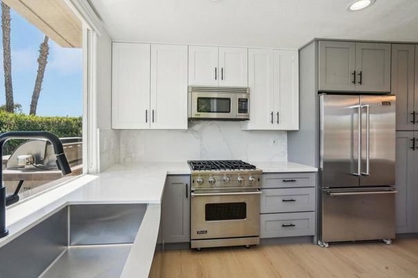 Interior, Kitchen, Marble Walls, Recessed Lighting, Stainless Steel Appliances, Wood Texture Flooring